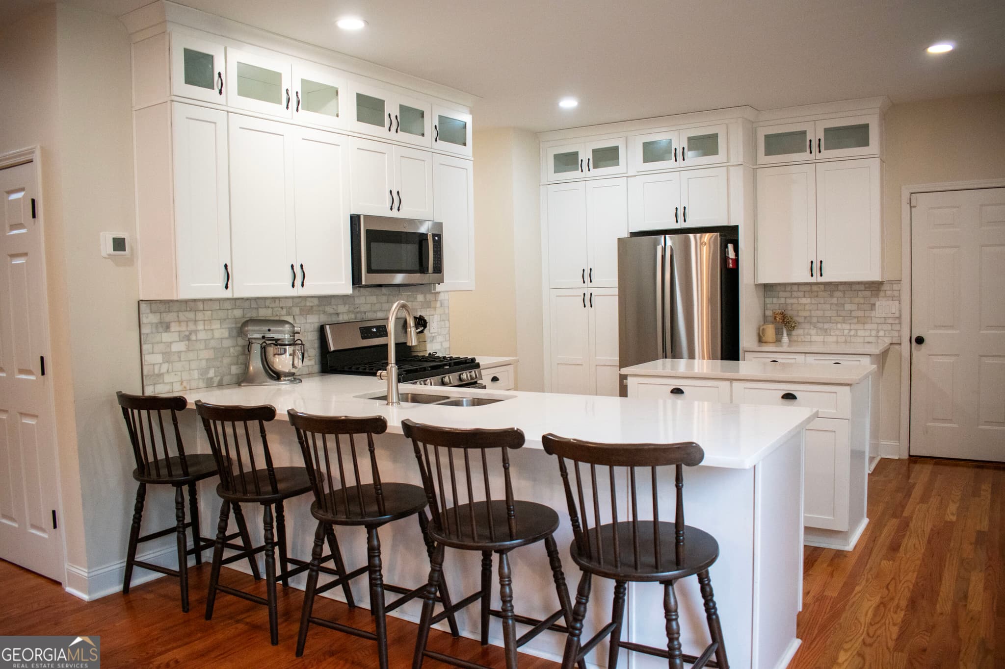 5 bedroom, 3.5 bathroom, 3,425 sq ft single family residence for sale at 2735 Hanson Court, Cumming, GA 30041 — photo 7