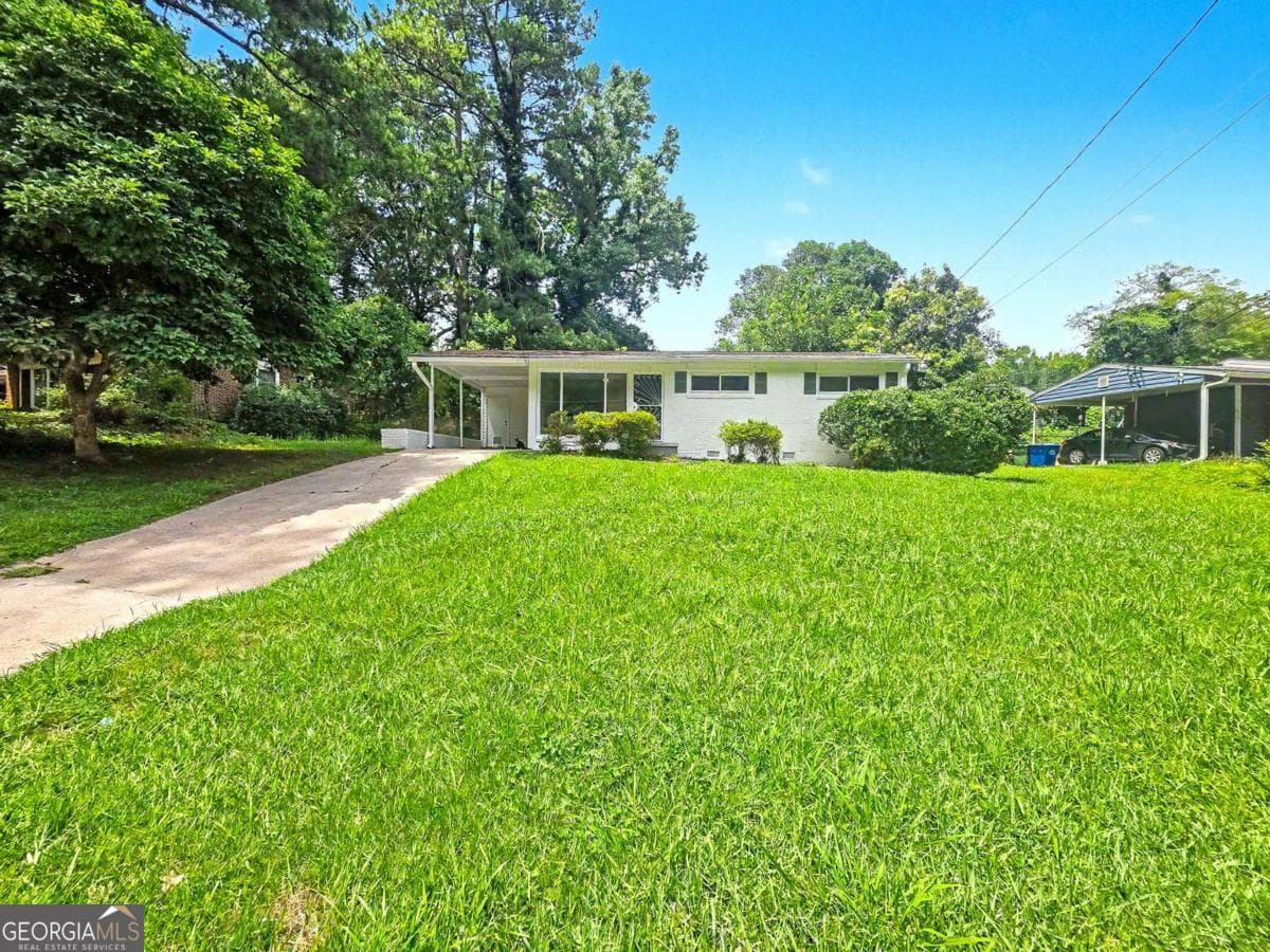 3 bedroom, 2 bathroom, 1,296 sq ft single family residence for sale at 2559 Dale Creek Drive, Atlanta, GA 30318 — photo 2