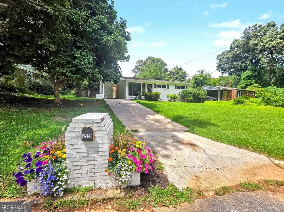 3 bedroom, 2 bathroom, 1,296 sq ft single family residence for sale at 2559 Dale Creek Drive, Atlanta, GA 30318 — photo 1 of 44