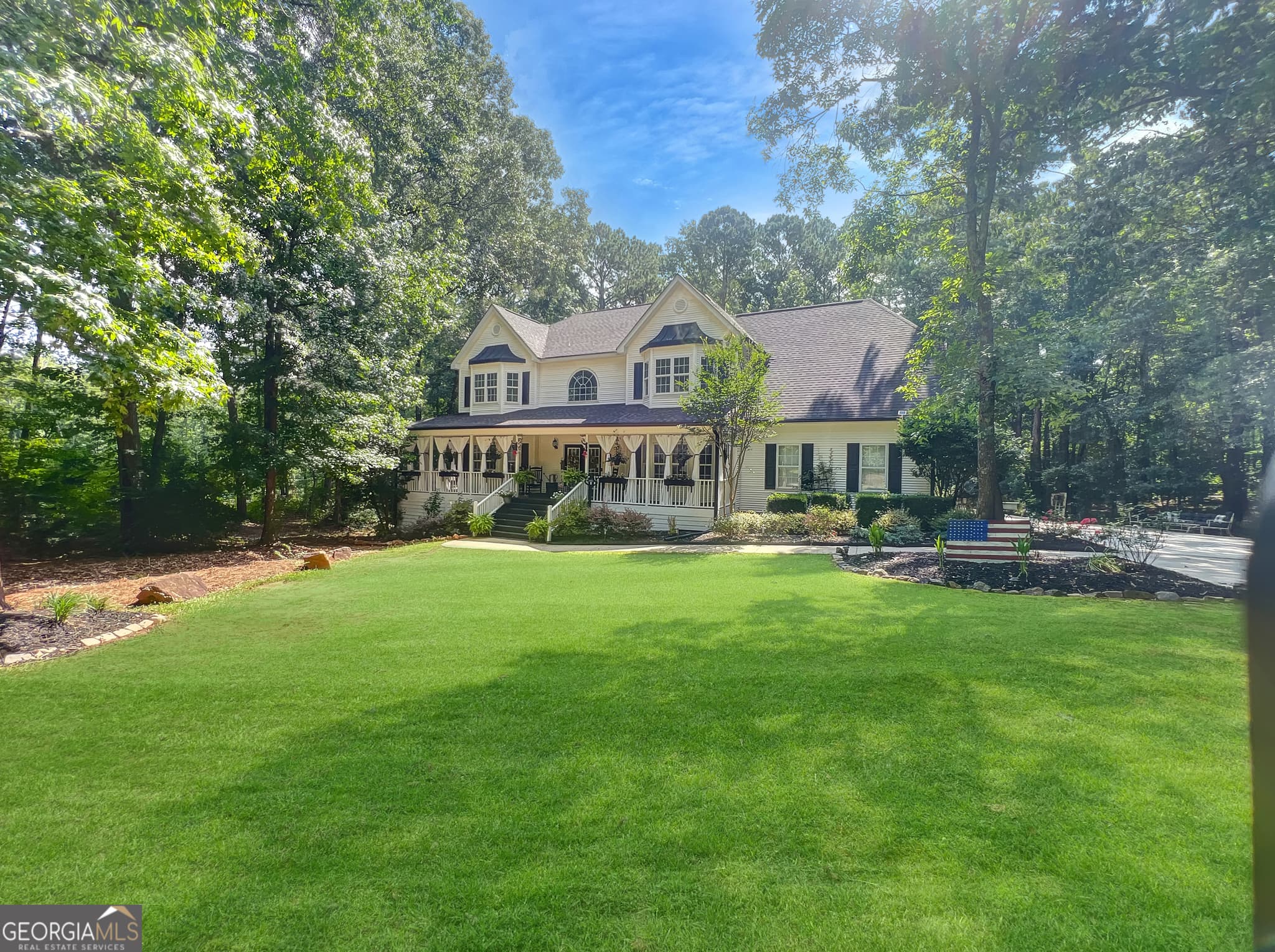 4 bedroom, 4.5 bathroom, 4,566 sq ft single family residence for sale at 385 Minix Road, Sharpsburg, GA 30277 — photo 1 of 54