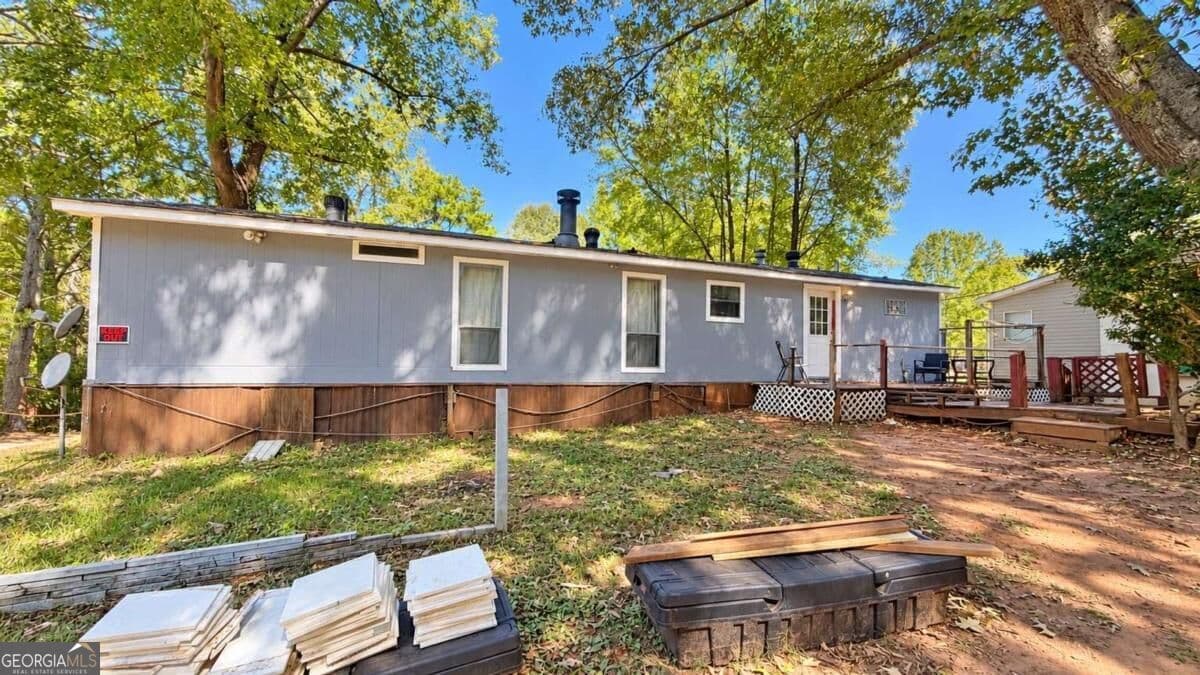 3 bedroom, 1.5 bathroom, 1,350 sq ft manufactured home,single family residence for sale at 115 Skyline Drive, Hampton, GA 30228 — photo 2
