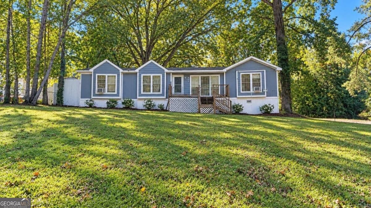 3 bedroom, 1.5 bathroom, 1,350 sq ft manufactured home,single family residence for sale at 115 Skyline Drive, Hampton, GA 30228 — photo 1 of 7