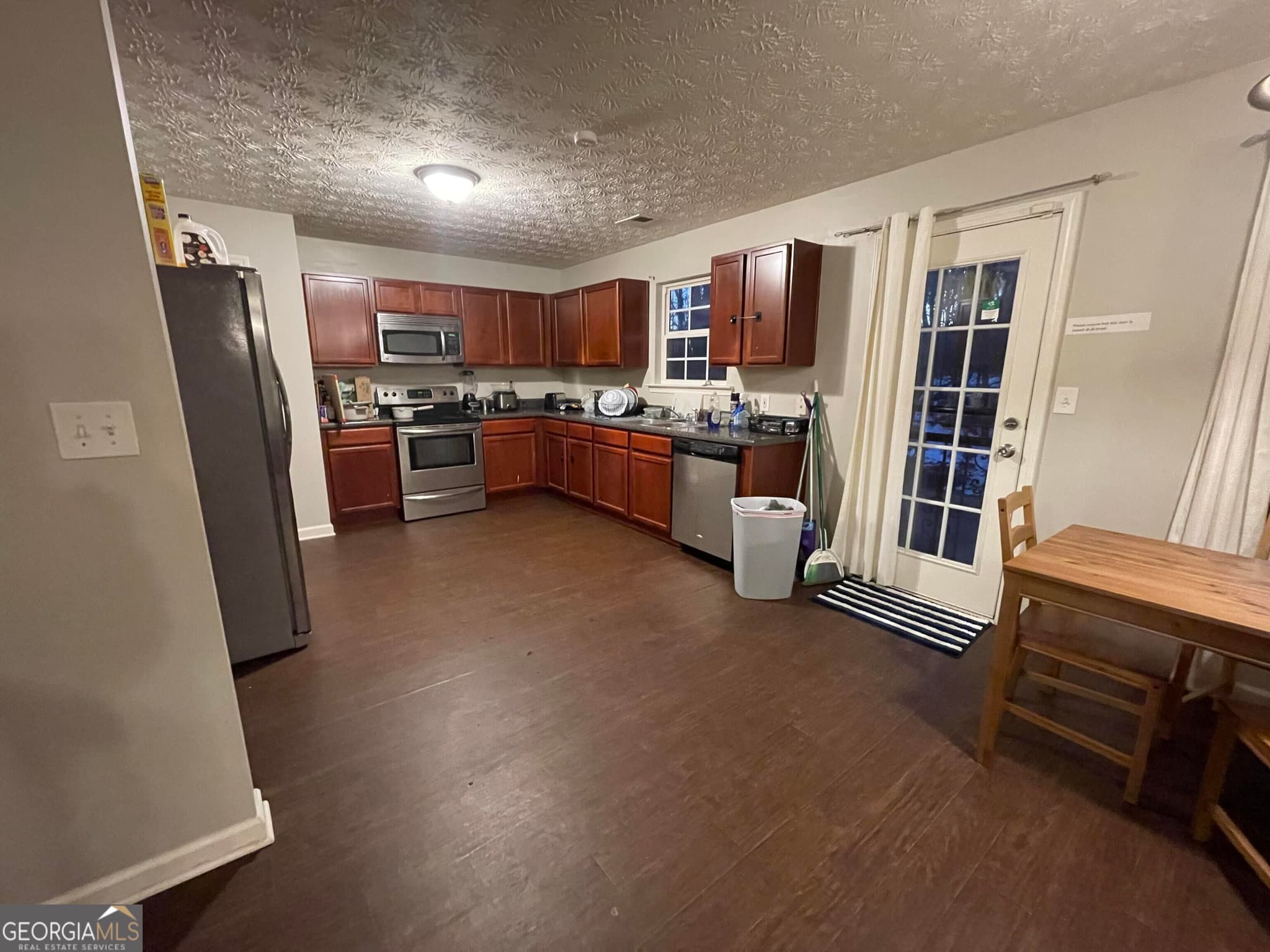 7 bedroom, 4 bathroom, 2,982 sq ft single family residence for sale at 5765 Shoals Place Trail, Atlanta, GA 30349 — photo 4