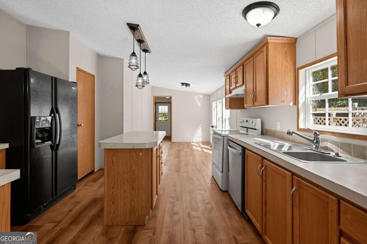3 bedroom, 2 bathroom manufactured home,single family residence for sale at 194 Forge Mill Estates Drive, Morganton, GA 30560 — photo 3