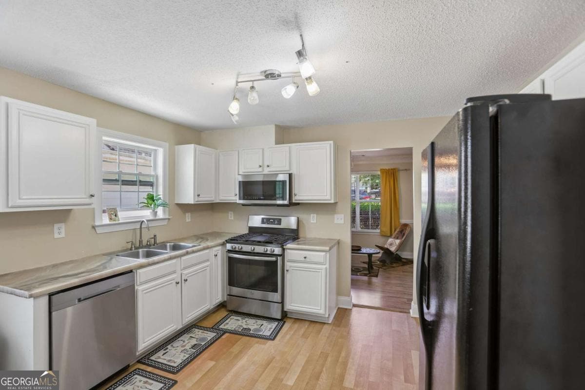 5 bedroom, 3 bathroom, 2,724 sq ft single family residence for sale at 1586 Rice Square, Lithonia, GA 30058 — photo 2