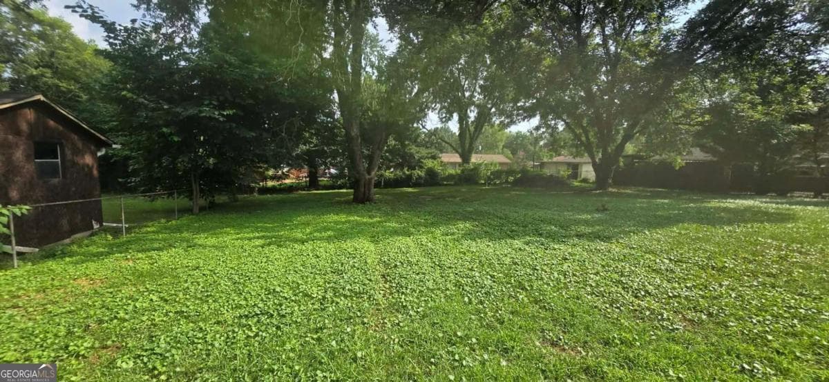 4 bedroom, 2 bathroom, 1,382 sq ft single family residence for sale at 1156 E Fayetteville Road, Riverdale, GA 30296 — photo 5