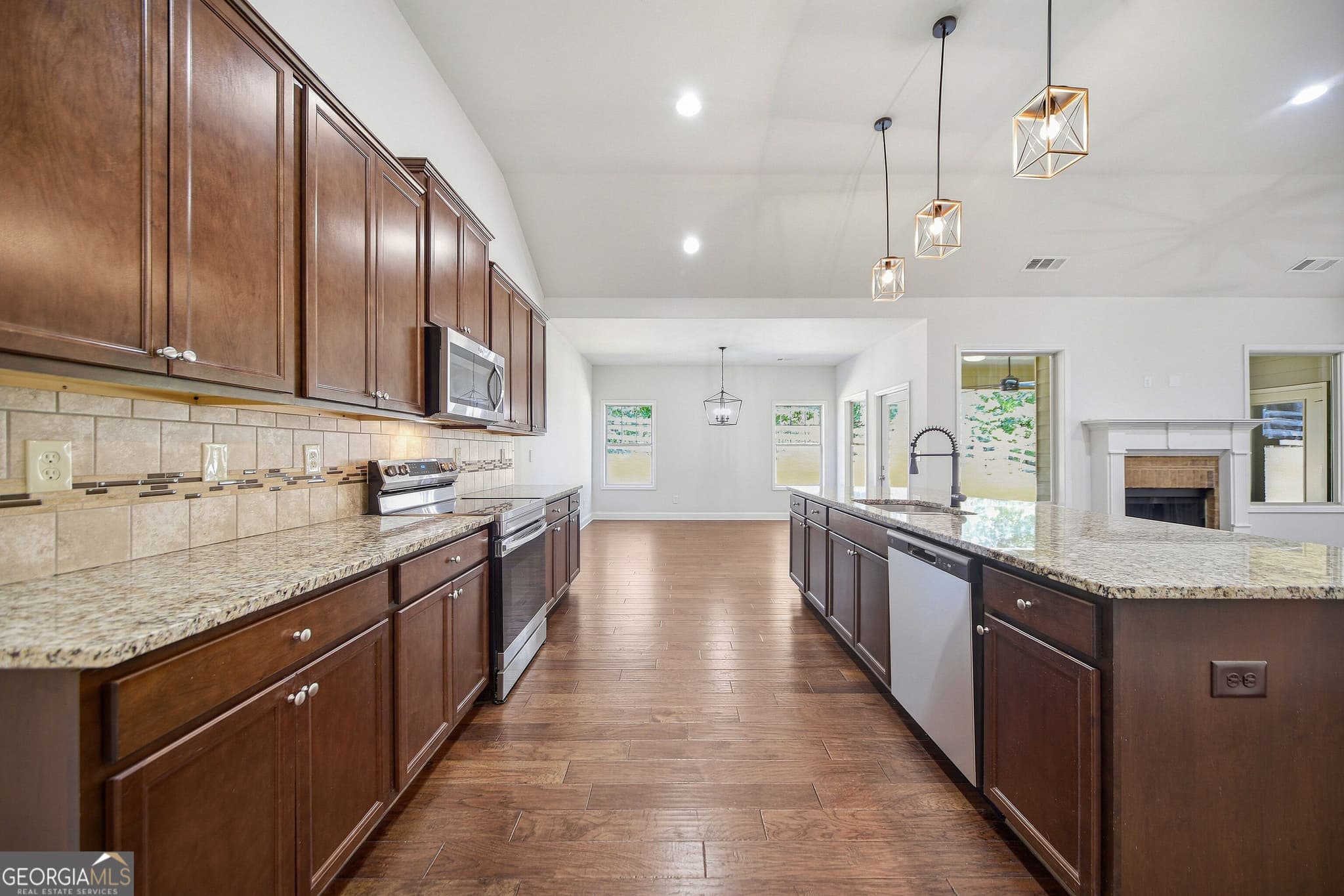 4 bedroom, 3 bathroom, 2,440 sq ft single family residence for sale at 6372 Spring Cove Drive, Flowery Branch, GA 30542 — photo 2