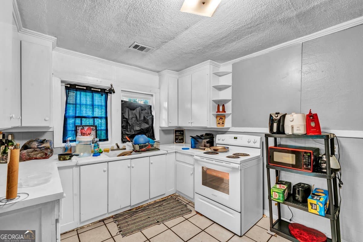 4 bedroom, 2 bathroom, 1,561 sq ft single family residence for sale at 316 E 23rd Avenue, Cordele, GA 31015 — photo 6
