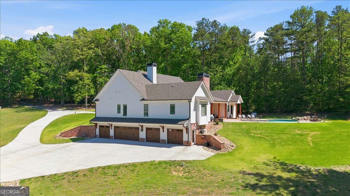 5 bedroom, 6 bathroom, 6,071 sq ft single family residence for sale at 395 Heard Road, Canton, GA 30114 — photo 2