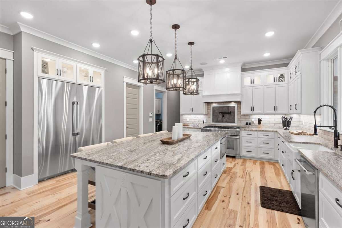5 bedroom, 6 bathroom, 6,071 sq ft single family residence for sale at 395 Heard Road, Canton, GA 30114 — photo 10