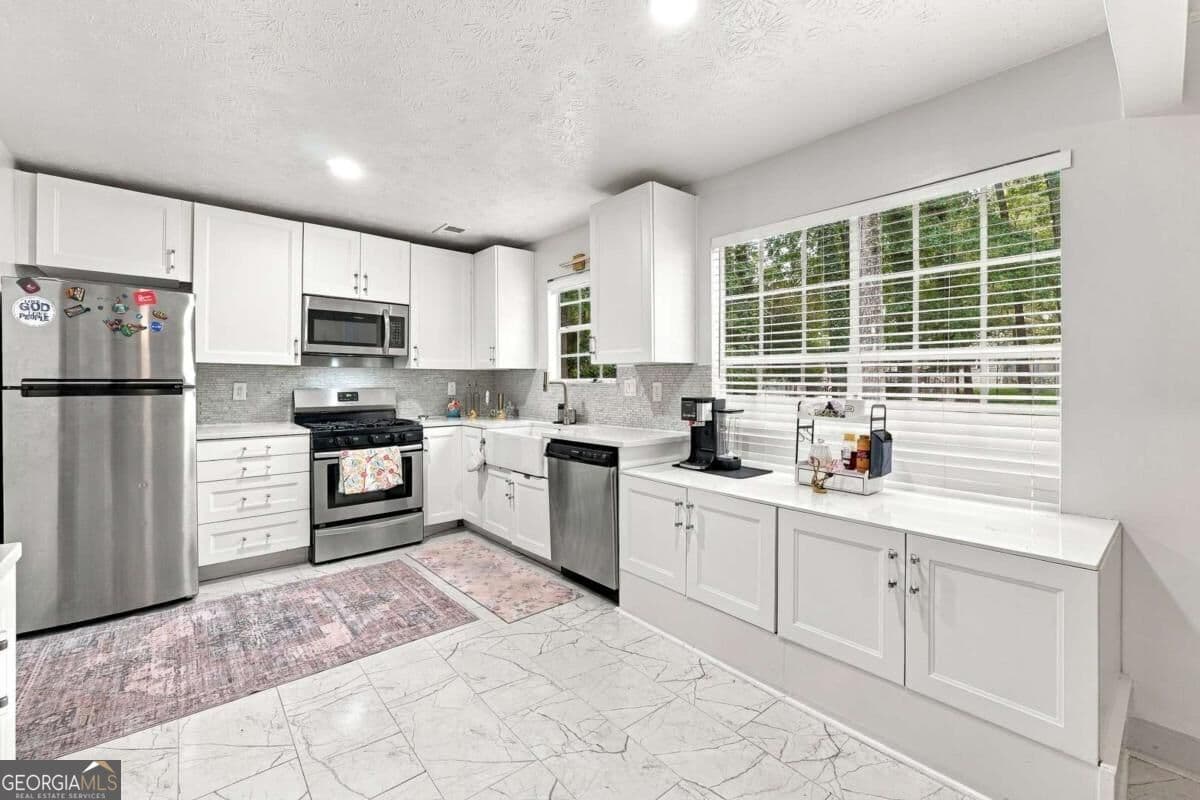 3 bedroom, 2 bathroom, 1,612 sq ft single family residence for sale at 2170 Laurel Mill Way, Roswell, GA 30076 — photo 10