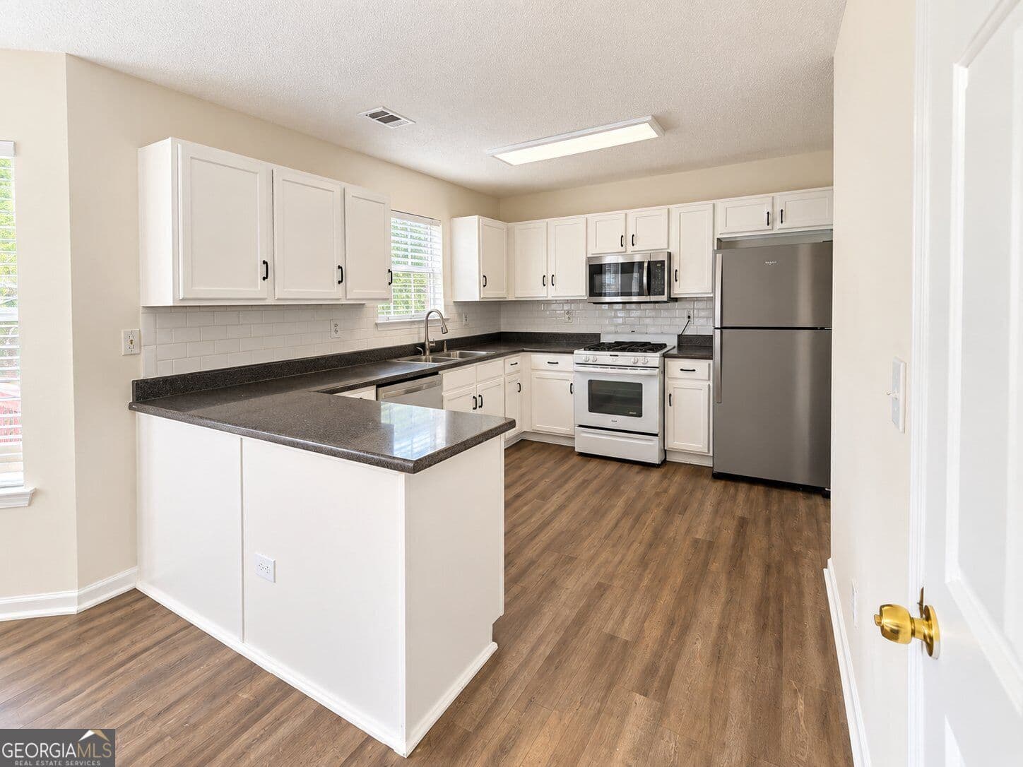 6 bedroom, 3.5 bathroom, 3,151 sq ft single family residence for sale at 3635 Spring Mesa Drive, Snellville, GA 30039 — photo 2
