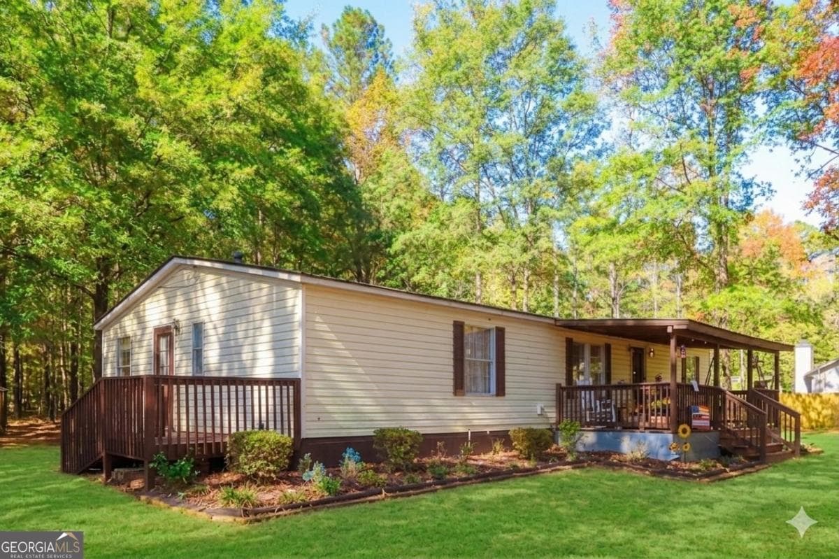 4 bedroom, 2 bathroom, 1,566 sq ft manufactured home,single family residence sold at 1424 Al Roberts Road, Senoia, GA 30276