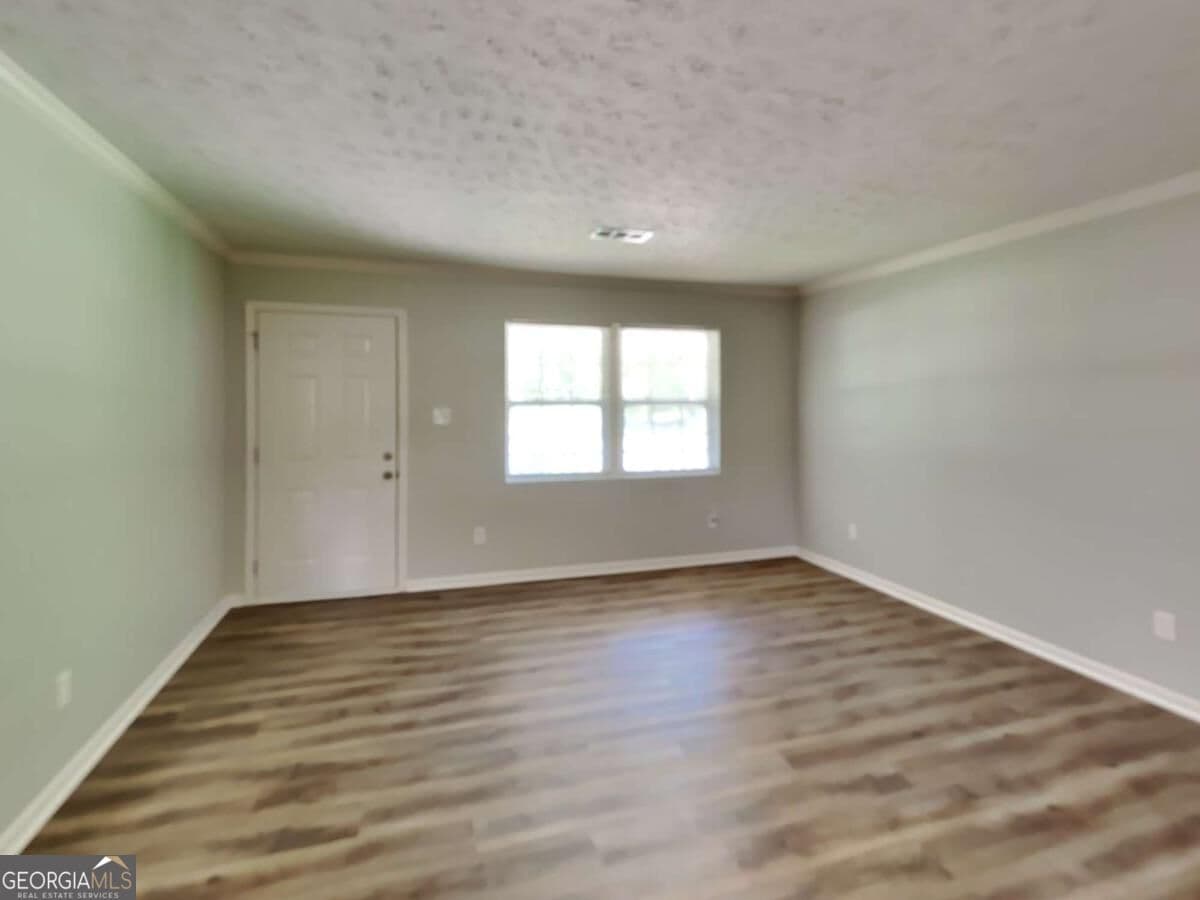 3 bedroom, 1 bathroom single family residence for rent at 555 Womack Road, Covington, GA 30016 for $1,570 a month — photo 3