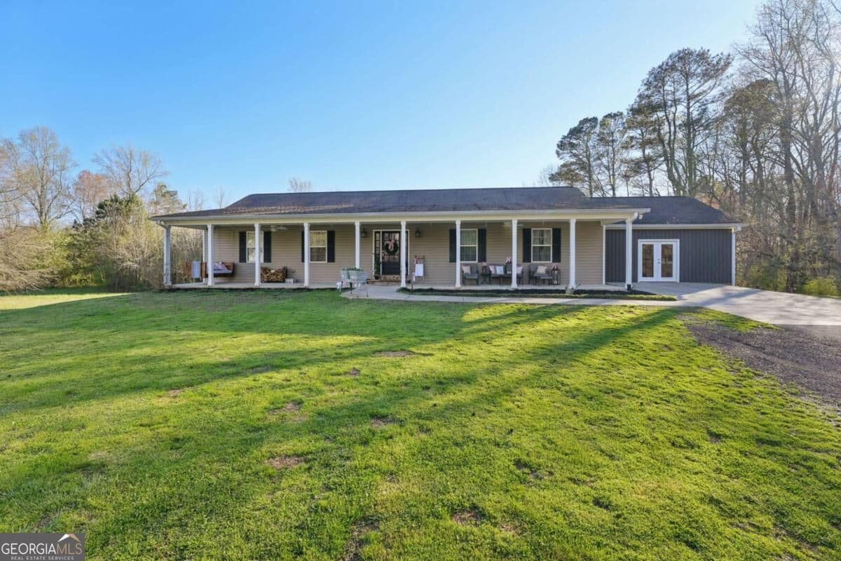 5 bedroom, 3 bathroom, 3,660 sq ft single family residence for sale at 6471 Forsyth Drive, Cumming, GA 30028