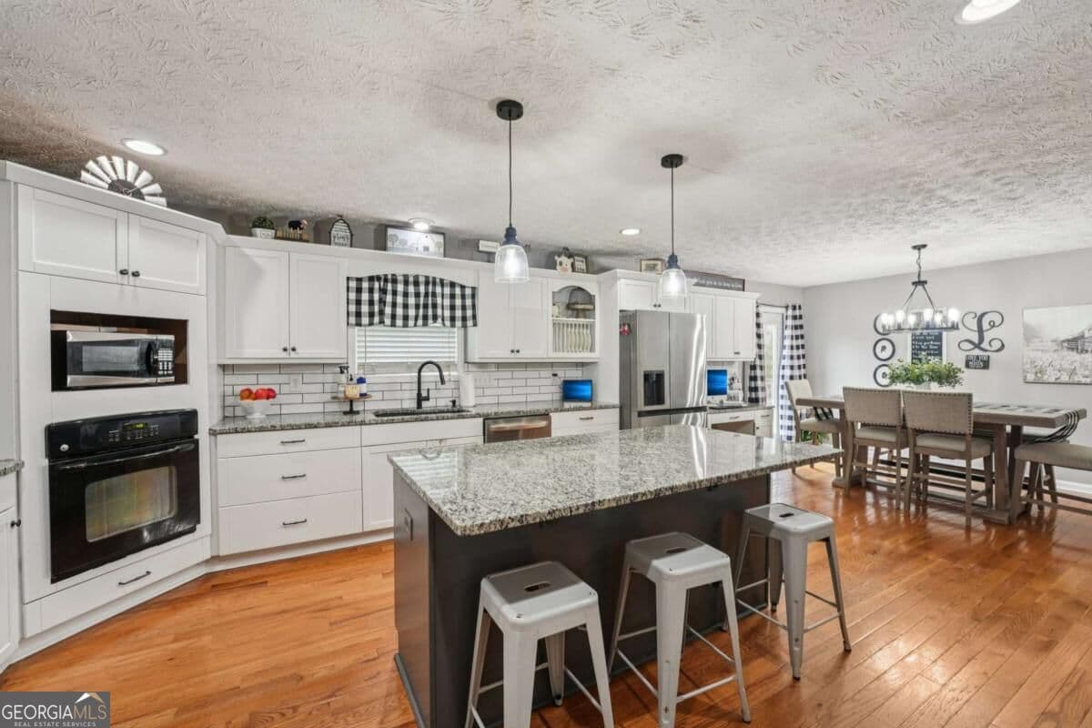 5 bedroom, 3 bathroom, 3,660 sq ft single family residence for sale at 6471 Forsyth Drive, Cumming, GA 30028 — photo 8