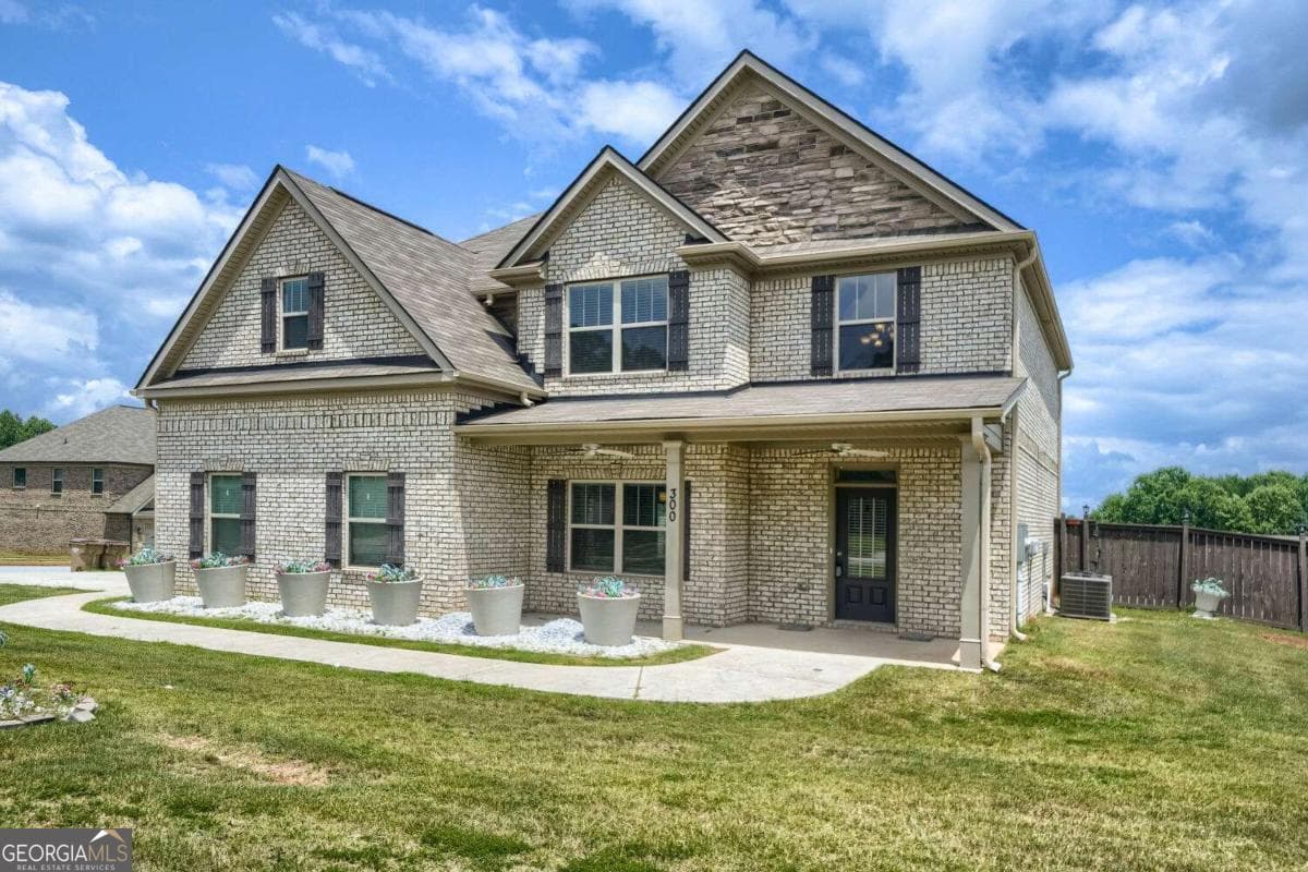 5 bedroom, 3 bathroom, 2,966 sq ft single family residence for sale at 300 Olympian Drive, Ellenwood, GA 30294 — photo 2