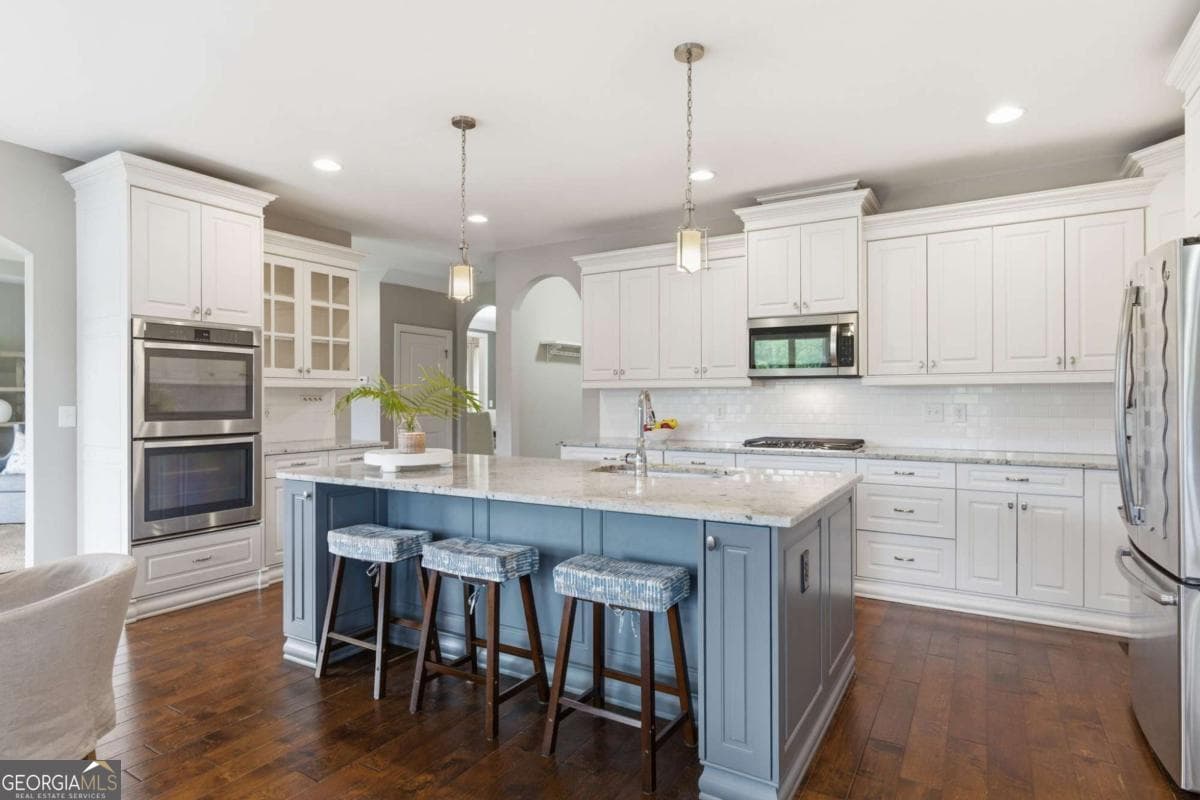 5 bedroom, 4 bathroom, 3,989 sq ft single family residence for sale at 4010 Pinebrook Circle, Cumming, GA 30028 — photo 5