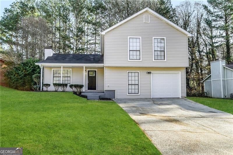 4 bedroom, 2 bathroom, 1,940 sq ft single family residence for sale at 1061 Mainstreet Lake Drive, Stone Mountain, GA 30088 — photo 1 of 24
