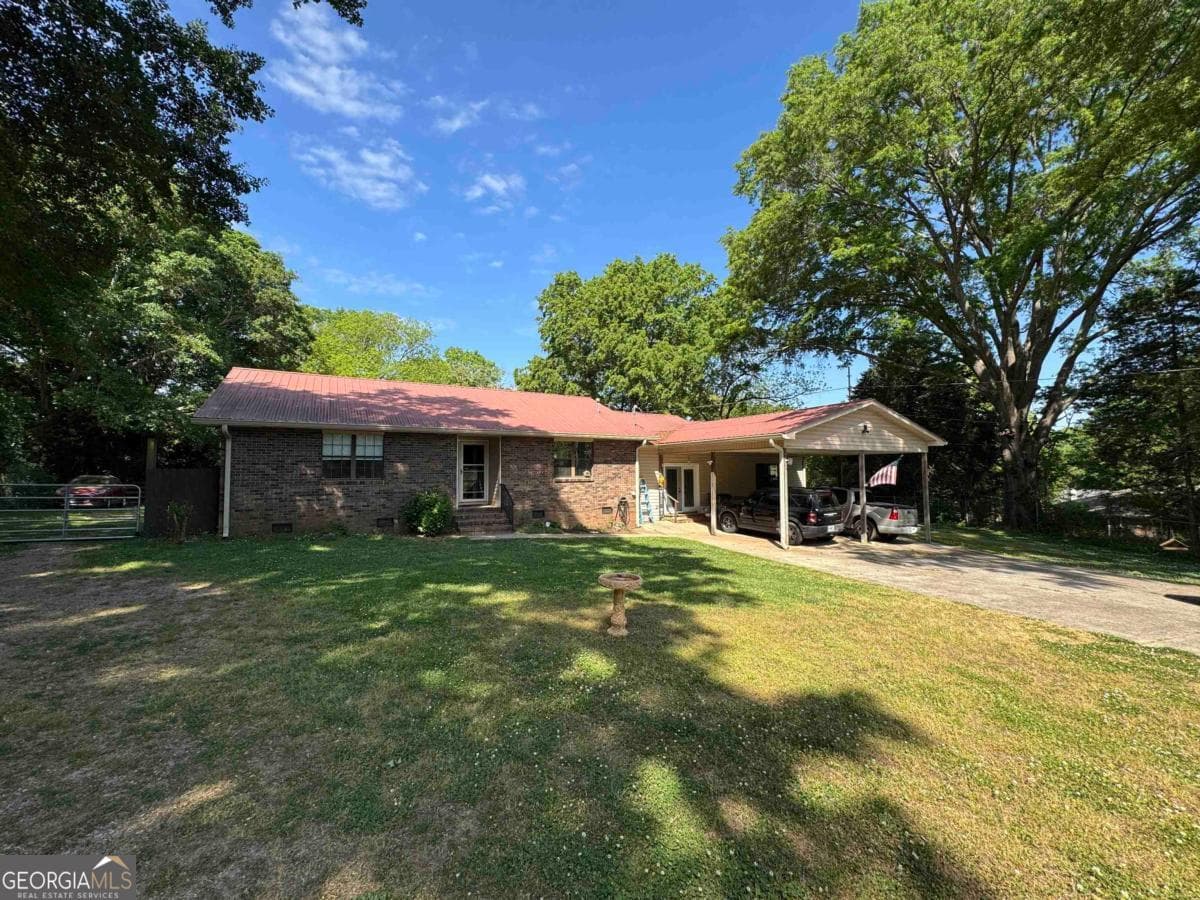 4 bedroom, 2 bathroom, 2,115 sq ft single family residence for sale at 103 Brookwood Drive, Eatonton, GA 31024 — photo 1 of 23