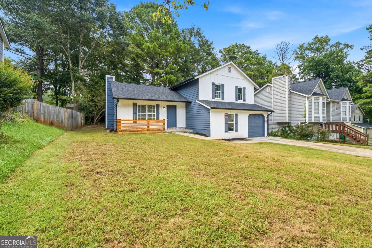 4 bedroom, 3 bathroom, 1,618 sq ft single family residence for sale at 917 Lake Watch Drive, Stone Mountain, GA 30088 — photo 2
