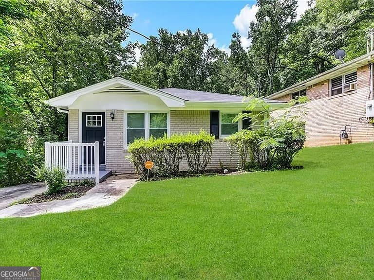 4 bedroom, 1 bathroom, 1,778 sq ft single family residence for sale at 2402 Main Street, Atlanta, GA 30318 — photo 1 of 3