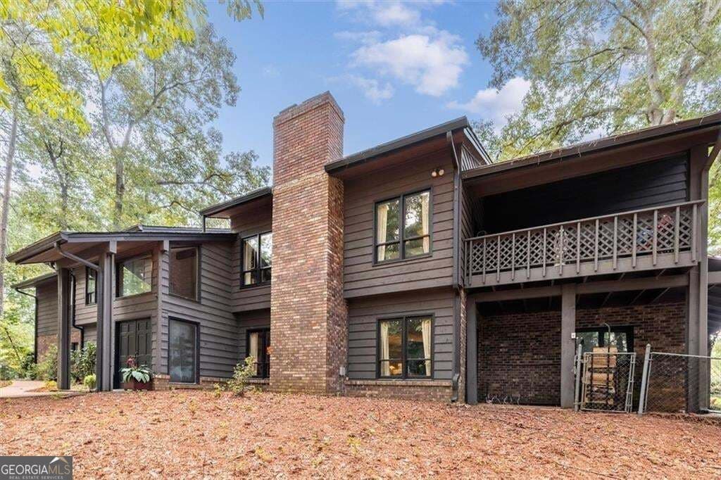 3 bedroom, 4 bathroom, 6,432 sq ft single family residence for sale at 1921 Lilburn Stone Mountain Road, Smoke Rise, GA 30087 — photo 2