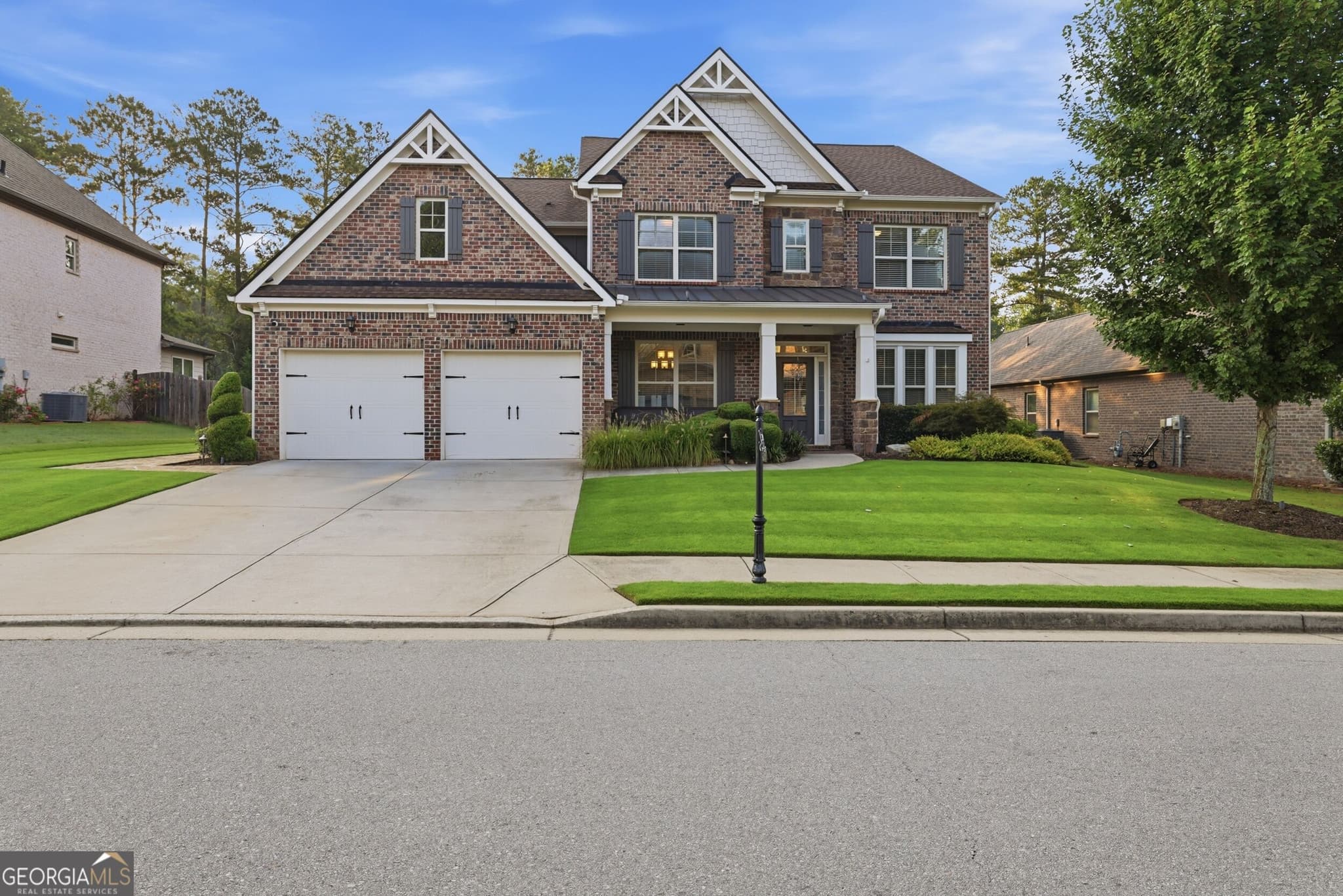 5 bedroom, 4 bathroom, 3,565 sq ft single family residence for sale at 4121 Secret Shoals Way, Buford, GA 30518 — photo 2