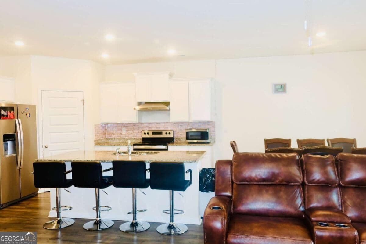 5 bedroom, 3.5 bathroom, 2,812 sq ft single family residence for sale at 1841 Vidalia Court, Dacula, GA 30019 — photo 4