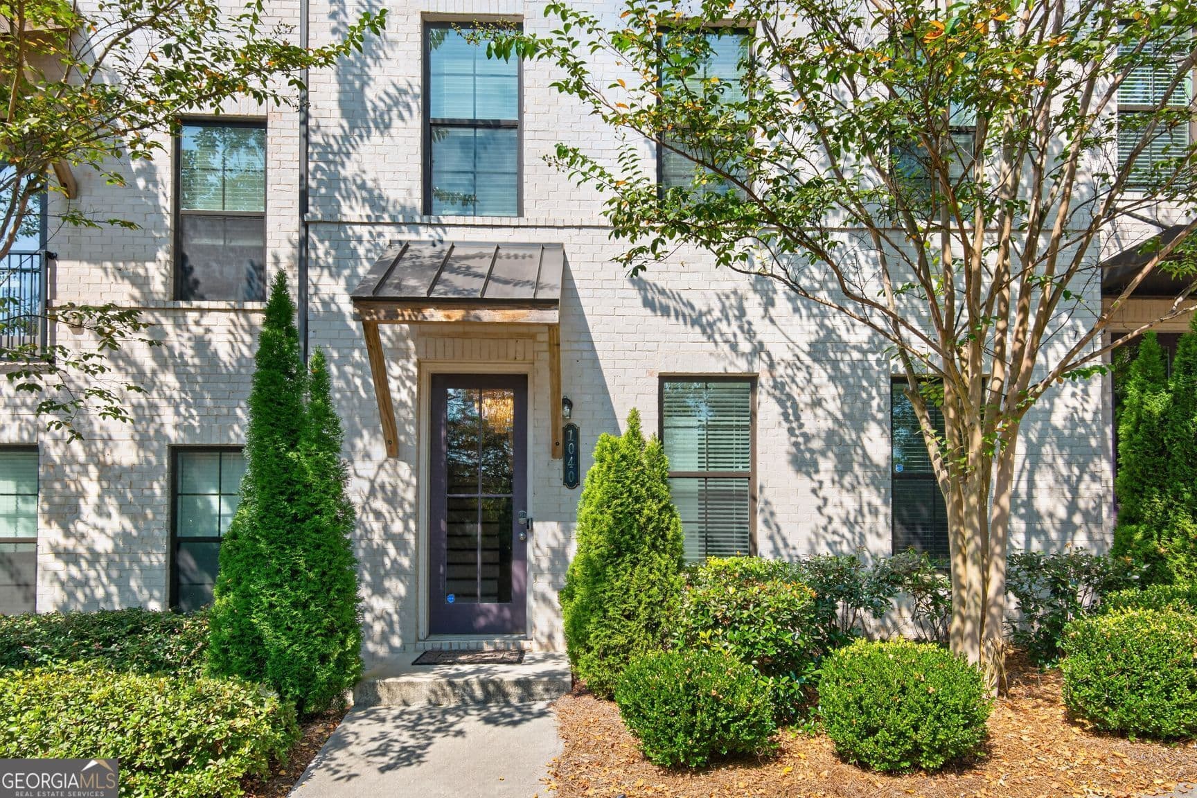 4 bedroom, 3.5 bathroom, 2,295 sq ft townhouse for sale at 1040 Aster Road, Roswell, GA 30075 — photo 1 of 27