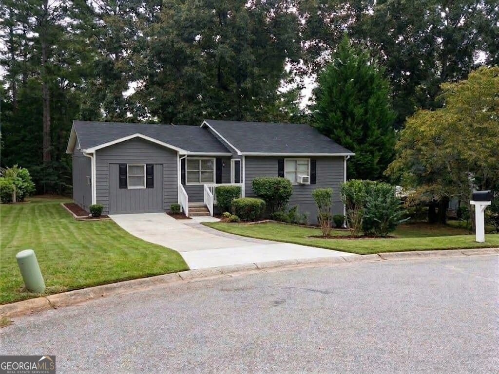 4 bedroom, 2.5 bathroom, 1,406 sq ft single family residence for sale at 4720 RALEIGH Court, Conyers, GA 30094 — photo 2