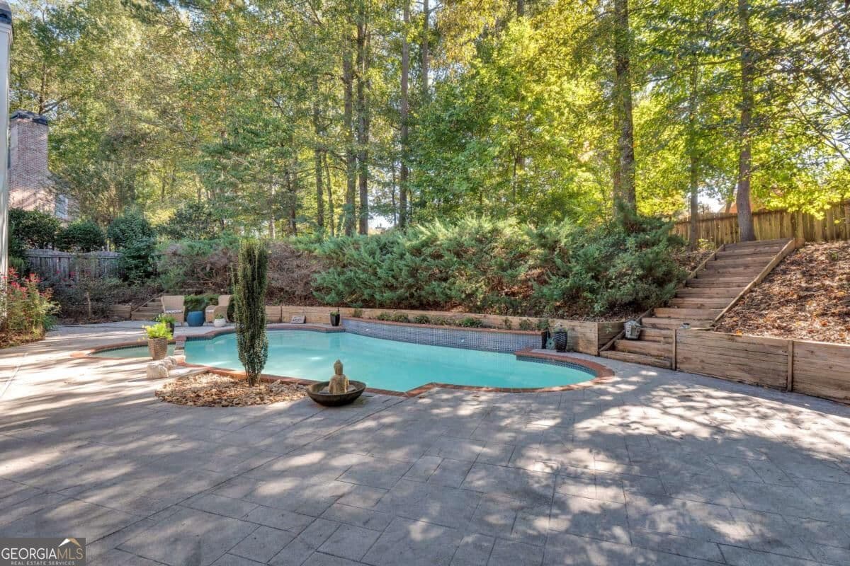 6 bedroom, 4.5 bathroom, 4,940 sq ft single family residence for sale at 5296 Fern Park Court, Peachtree Corners, GA 30092 — photo 4