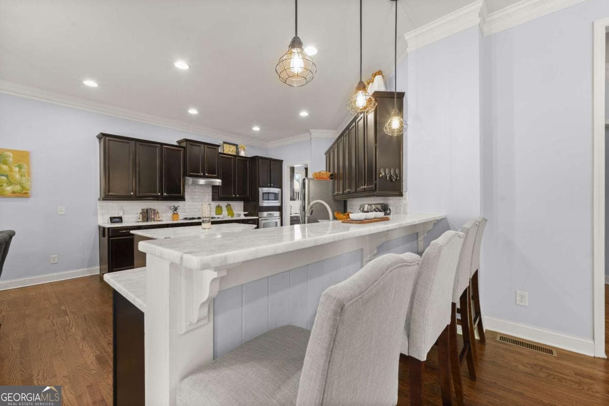 6 bedroom, 5 bathroom, 5,240 sq ft single family residence for sale at 11880 Old Station Place, Alpharetta, GA 30004 — photo 7
