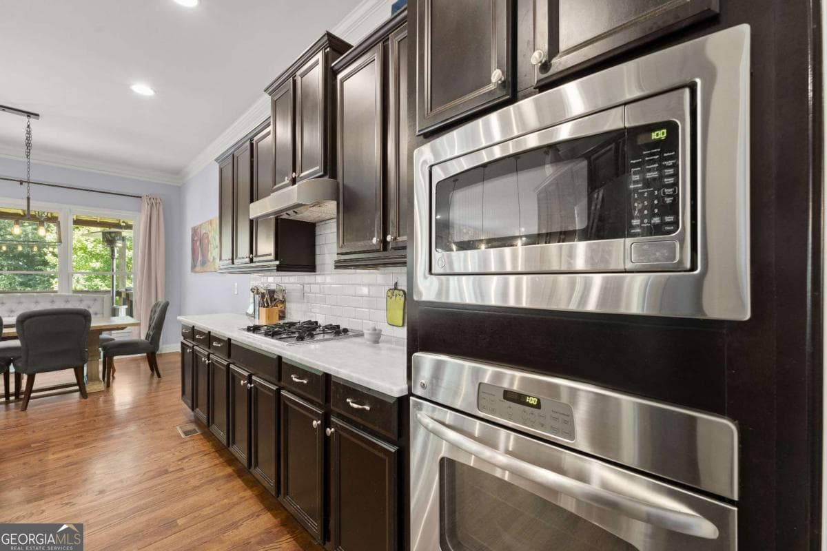 6 bedroom, 5 bathroom, 5,240 sq ft single family residence for sale at 11880 Old Station Place, Alpharetta, GA 30004 — photo 9