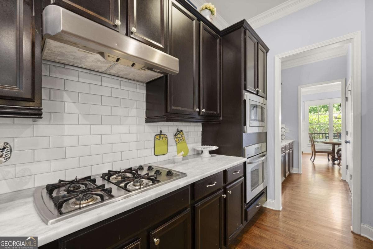 6 bedroom, 5 bathroom, 5,240 sq ft single family residence for sale at 11880 Old Station Place, Alpharetta, GA 30004 — photo 10