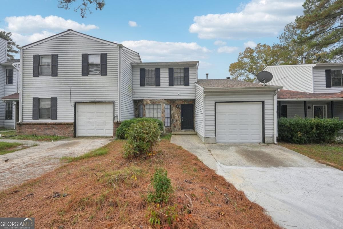 3 bedroom, 2 bathroom, 1,466 sq ft townhouse for sale at 703 Pine Tree Trail, Atlanta, GA 30349 — photo 1 of 22