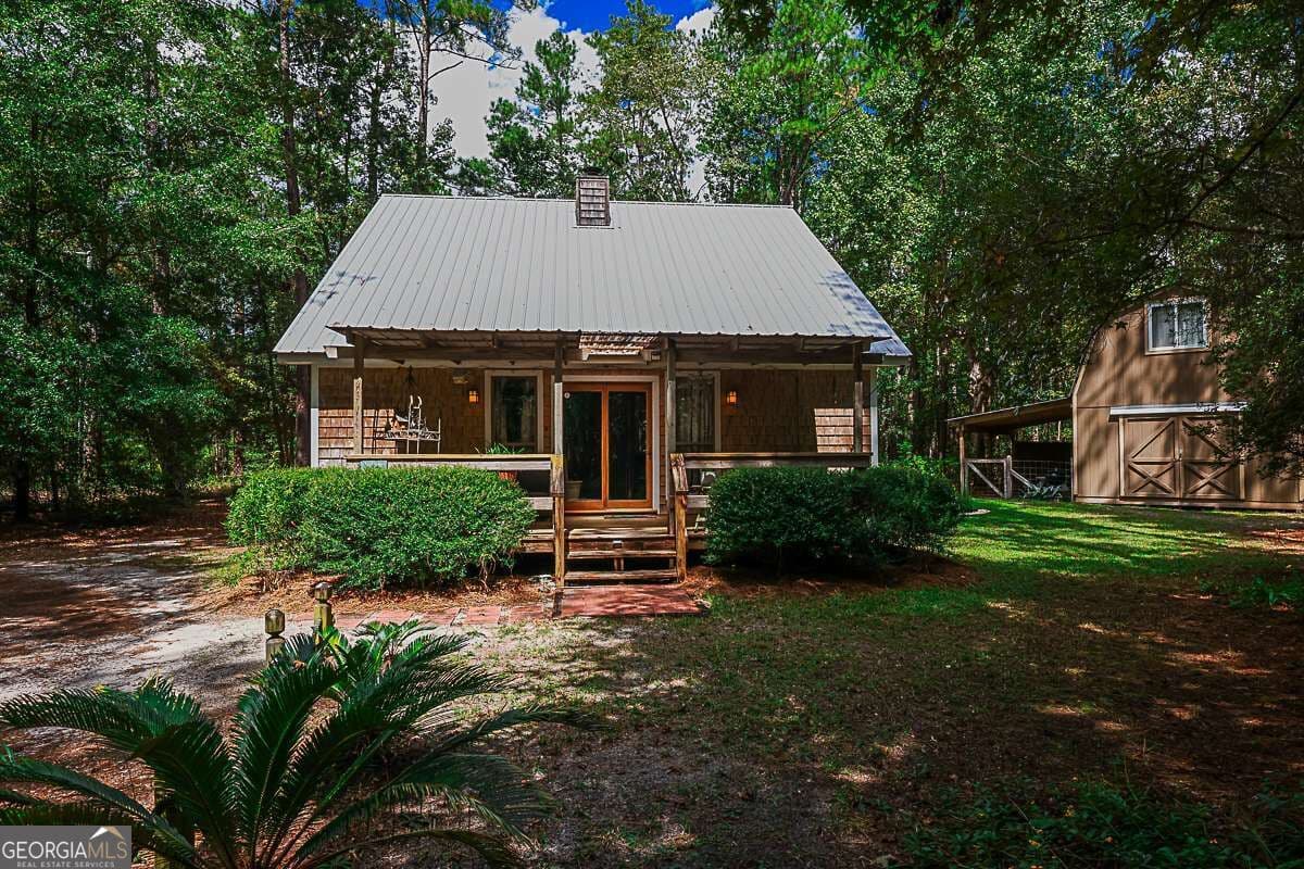 3 bedroom, 2 bathroom, 1,236 sq ft cabin,single family residence for sale at 401 Noel C Conaway Road, Guyton, GA 31312 — photo 2
