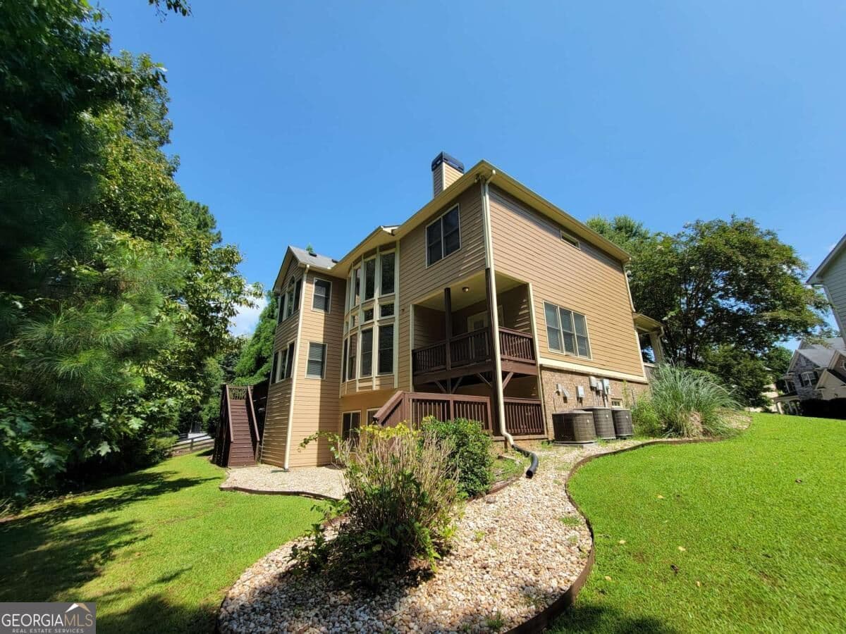 5 bedroom, 4.5 bathroom, 4,492 sq ft single family residence for sale at 6660 Granite Gate Pass, Cumming, GA 30028 — photo 2