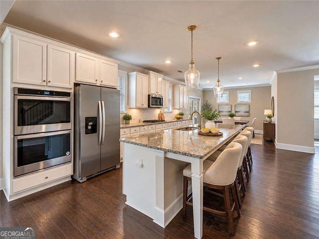 6 bedroom, 4 bathroom single family residence for sale at 6515 Yellow Birch Street, Cumming, GA 30040 — photo 6
