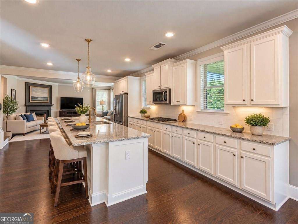 6 bedroom, 4 bathroom single family residence for sale at 6515 Yellow Birch Street, Cumming, GA 30040 — photo 7