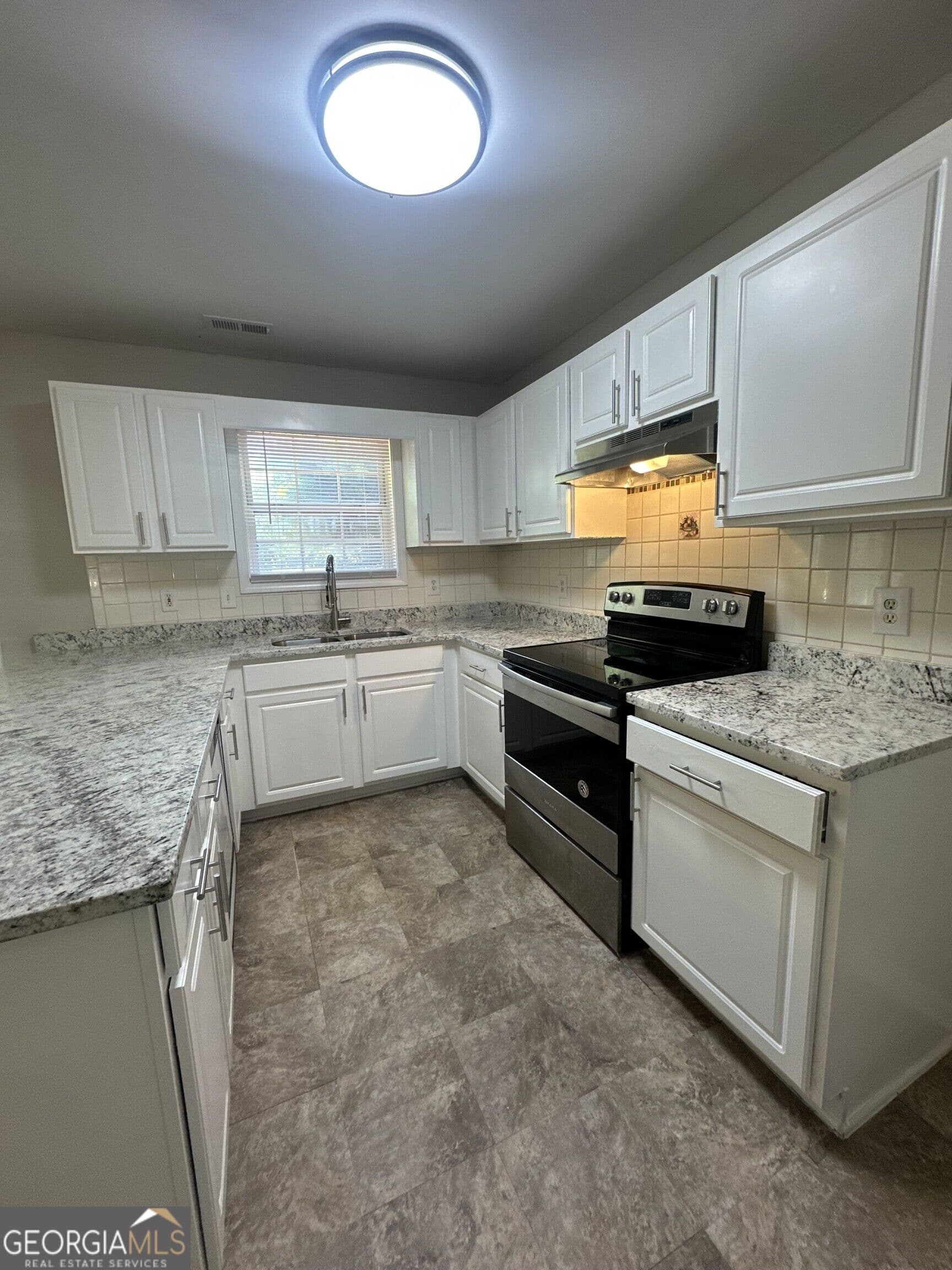 5 bedroom, 2 bathroom single family residence for sale at 1975 Hollow Trace Way, Norcross, GA 30071 — photo 4