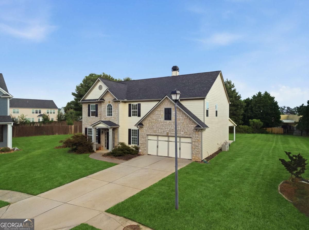 4 bedroom, 2.5 bathroom, 3,512 sq ft single family residence for sale at 1214 Loowit Falls Court, Braselton, GA 30517 — photo 2