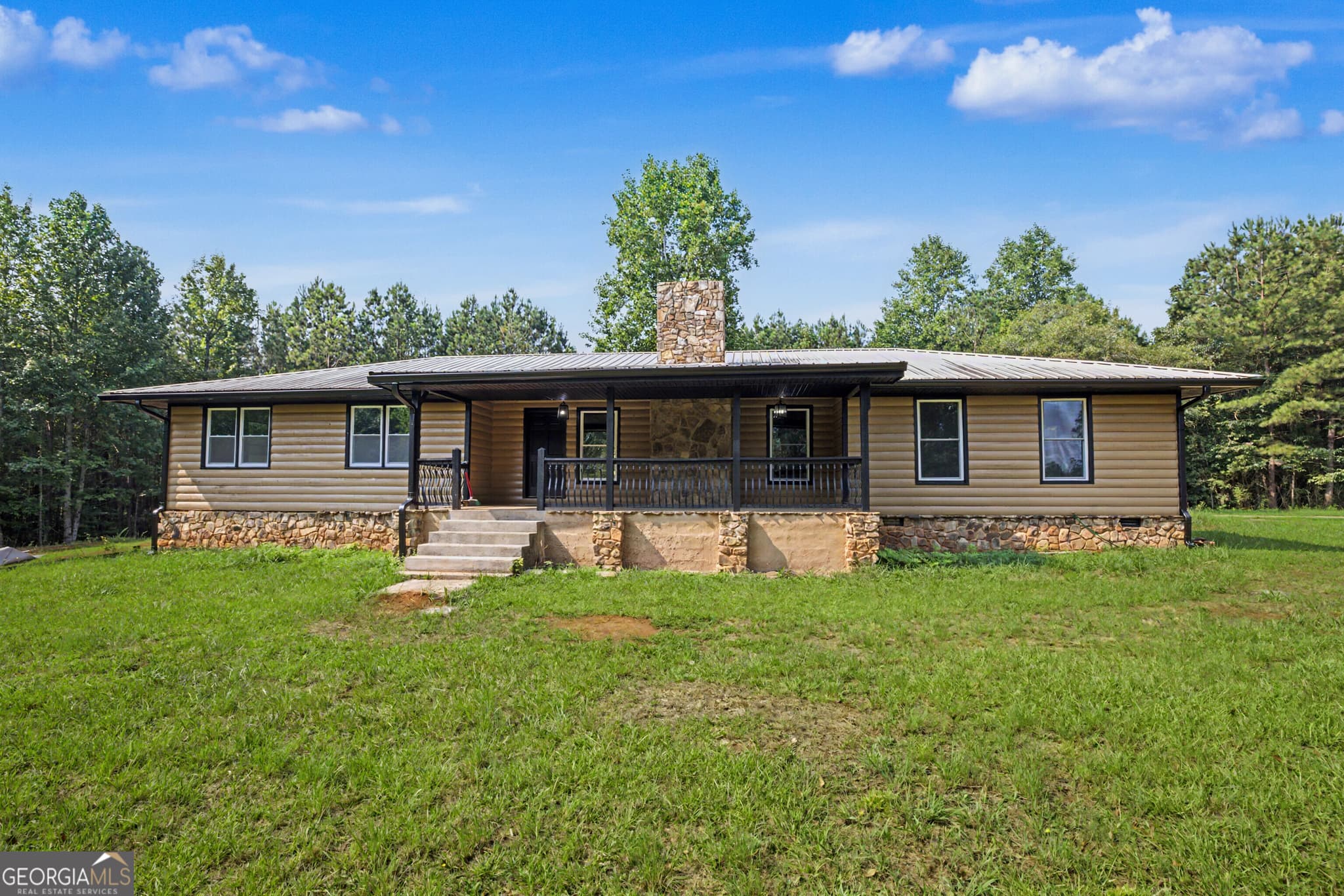 4 bedroom, 2 bathroom, 1,884 sq ft cabin,single family residence for sale at 385 Duncan Road, Carrollton, GA 30116