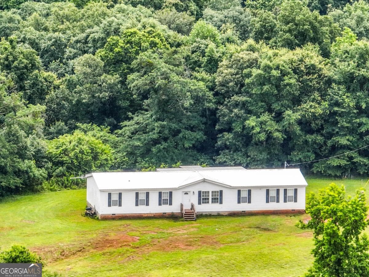 4 bedroom, 2 bathroom, 2,800 sq ft manufactured home,farm for sale at 397 Reed Brawner Road, Royston, GA 30662 — photo 1 of 34