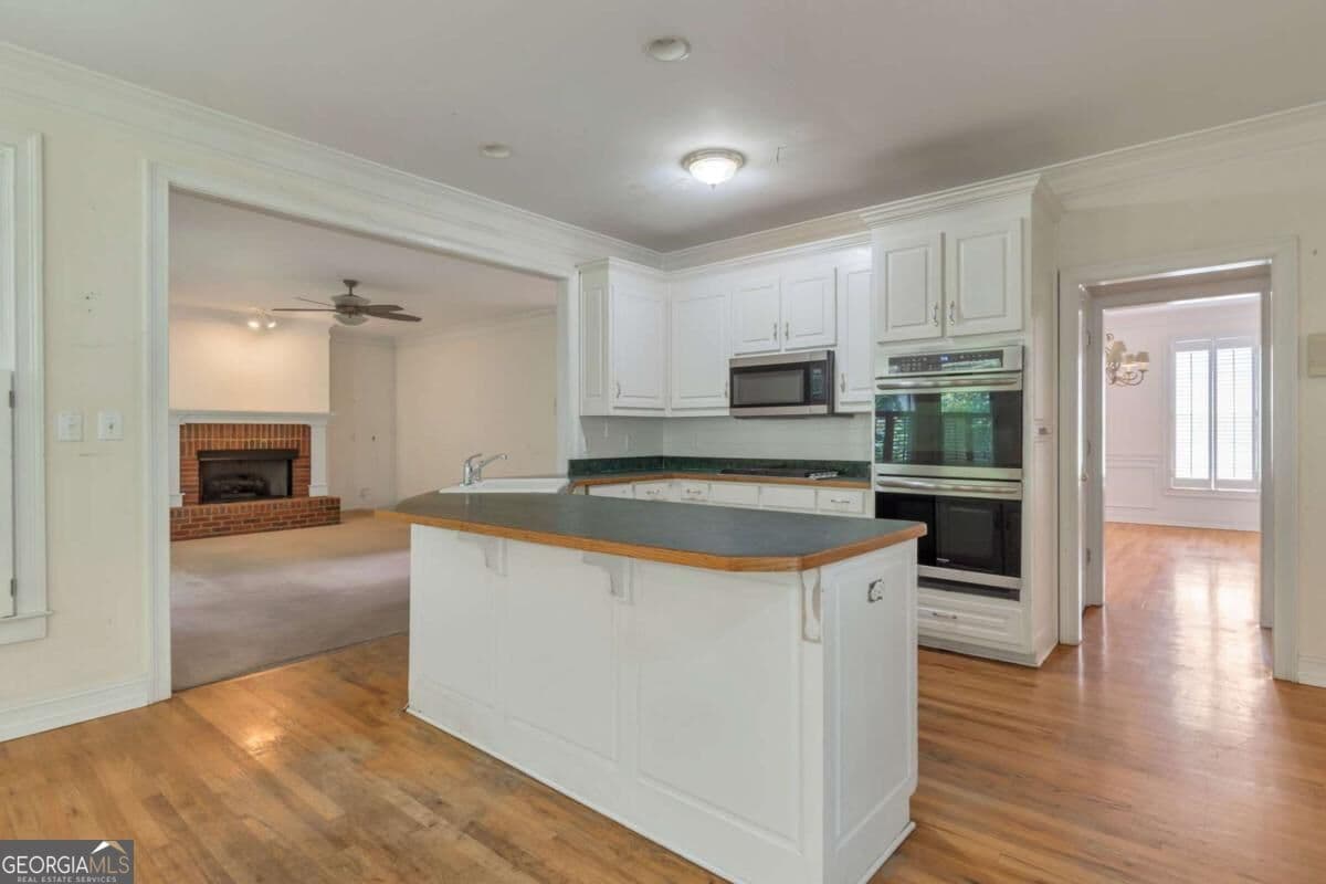 5 bedroom, 4.5 bathroom, 4,514 sq ft single family residence for sale at 5892 Millstone Lane, Stone Mountain, GA 30087 — photo 9