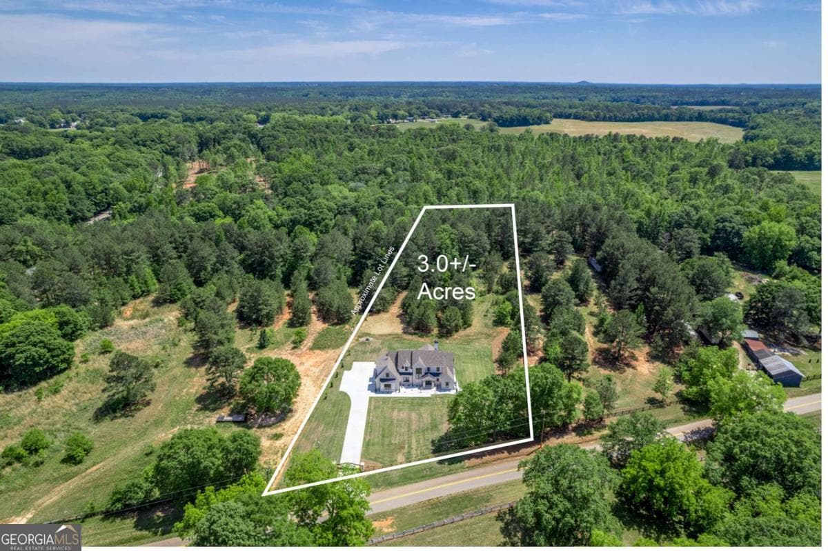 5 bedroom, 4.5 bathroom, 4,836 sq ft single family residence for sale at 2944-A George Williams Road, Monroe, GA 30656 — photo 2