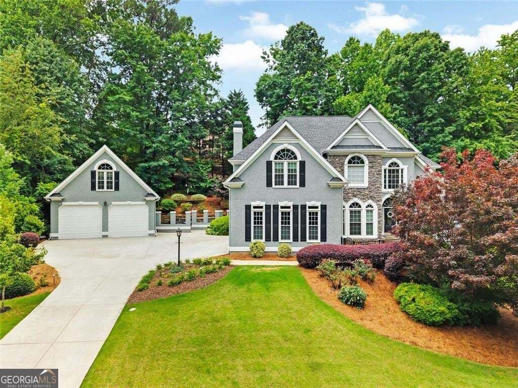 5 bedroom, 4 bathroom, 5,465 sq ft single family residence for sale at 5021 Towne Lake Hills, Woodstock, GA 30189 — photo 2