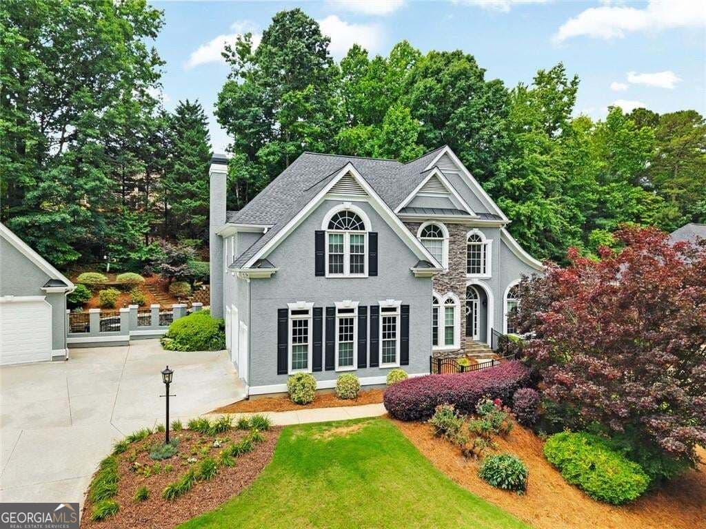 5 bedroom, 4 bathroom, 5,465 sq ft single family residence for sale at 5021 Towne Lake Hills, Woodstock, GA 30189 — photo 3