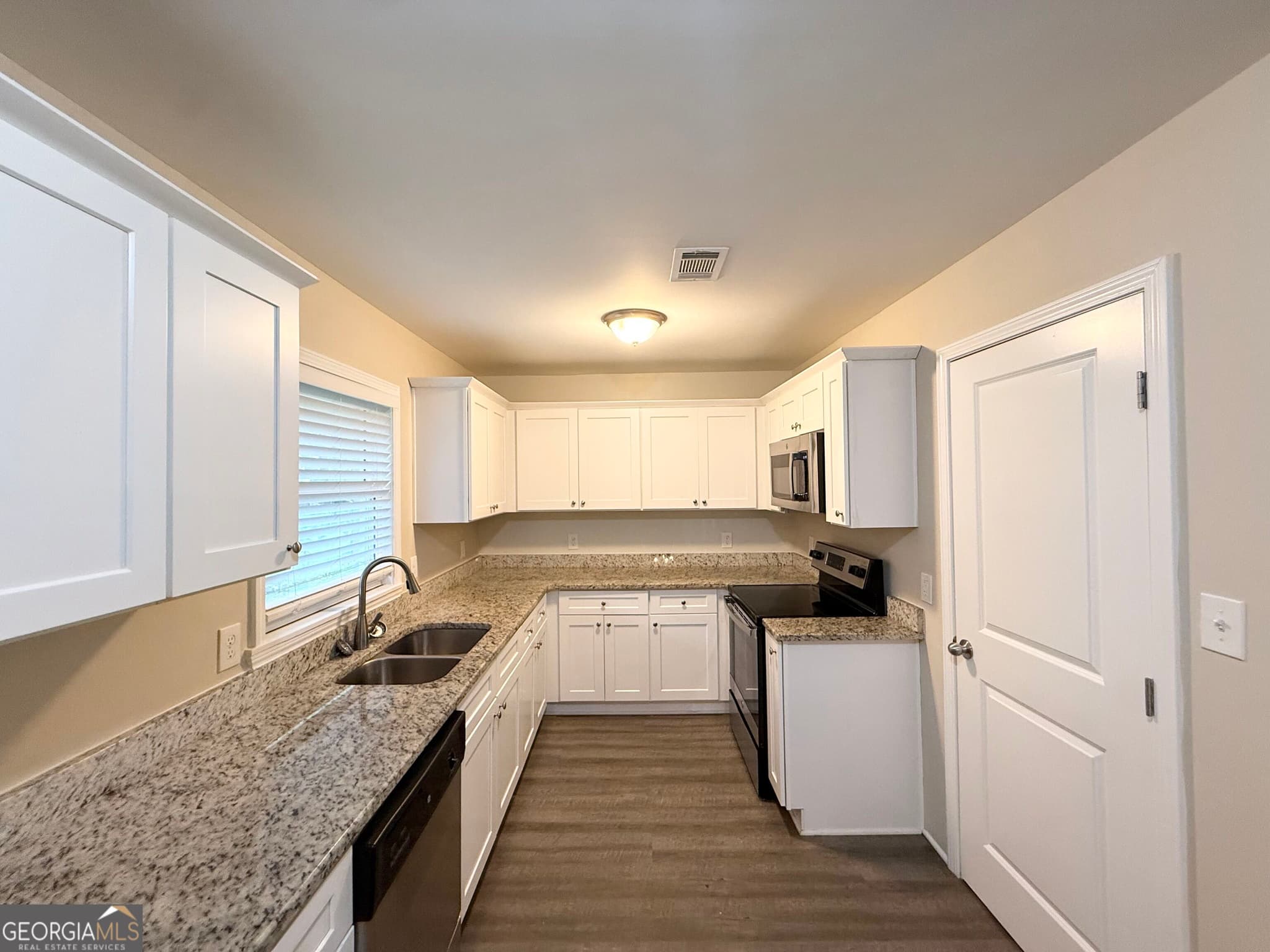 5 bedroom, 2 bathroom, 1,453 sq ft single family residence for sale at 1809 Old Peachtree Road, Lawrenceville, GA 30043 — photo 6