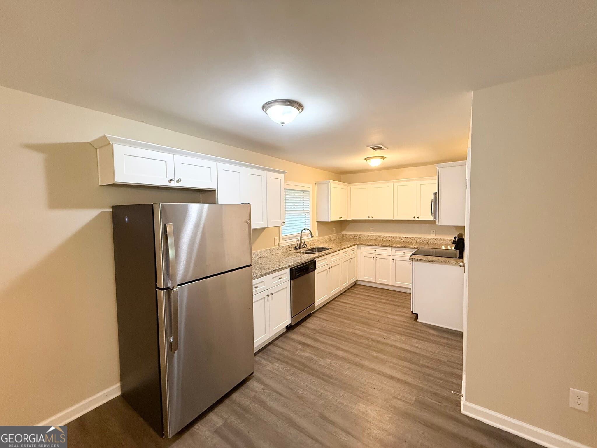 5 bedroom, 2 bathroom, 1,453 sq ft single family residence for sale at 1809 Old Peachtree Road, Lawrenceville, GA 30043 — photo 5
